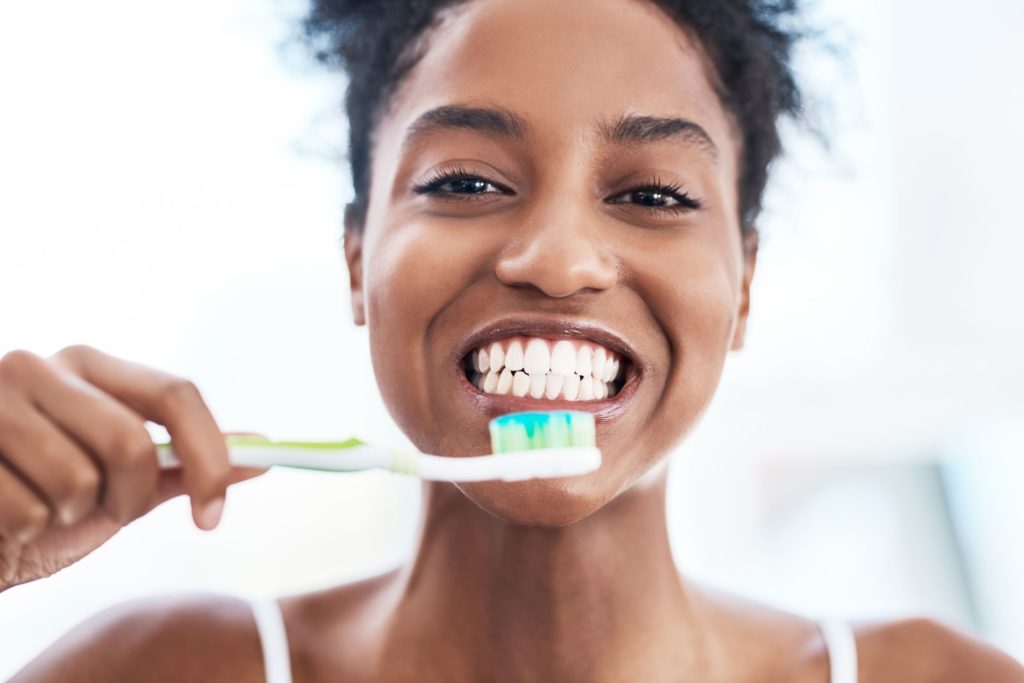 clean and brighten your smile with teeth brushing